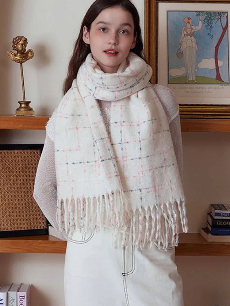 Close-up of a woman wearing a white plaid scarf with fringe