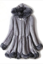 Grey faux fur coat with a hood and decorative closure