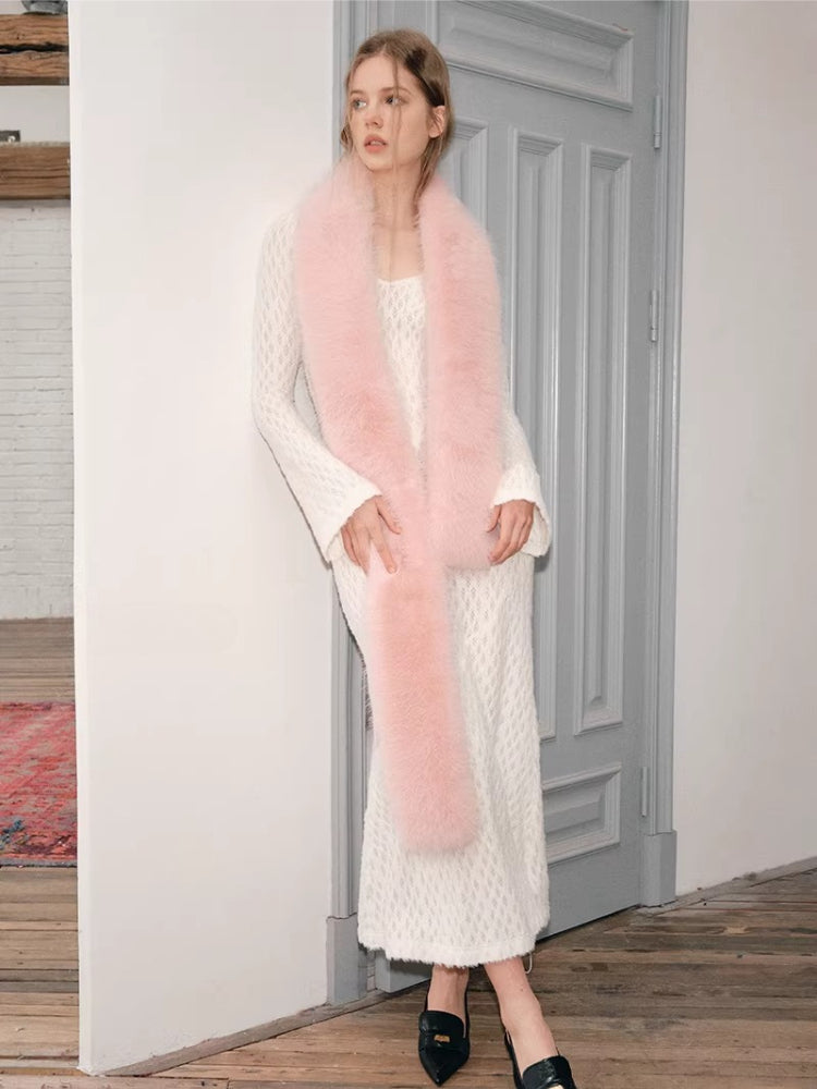 full body shot of a woman in a white dress and pink scarf