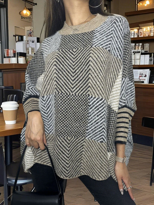 Close-up of a woman wearing a geometric pattern knit poncho