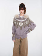 Woman wearing a purple and white Fair Isle knit zip-up cardigan with a faux fur trim hood and tan wide-leg pants