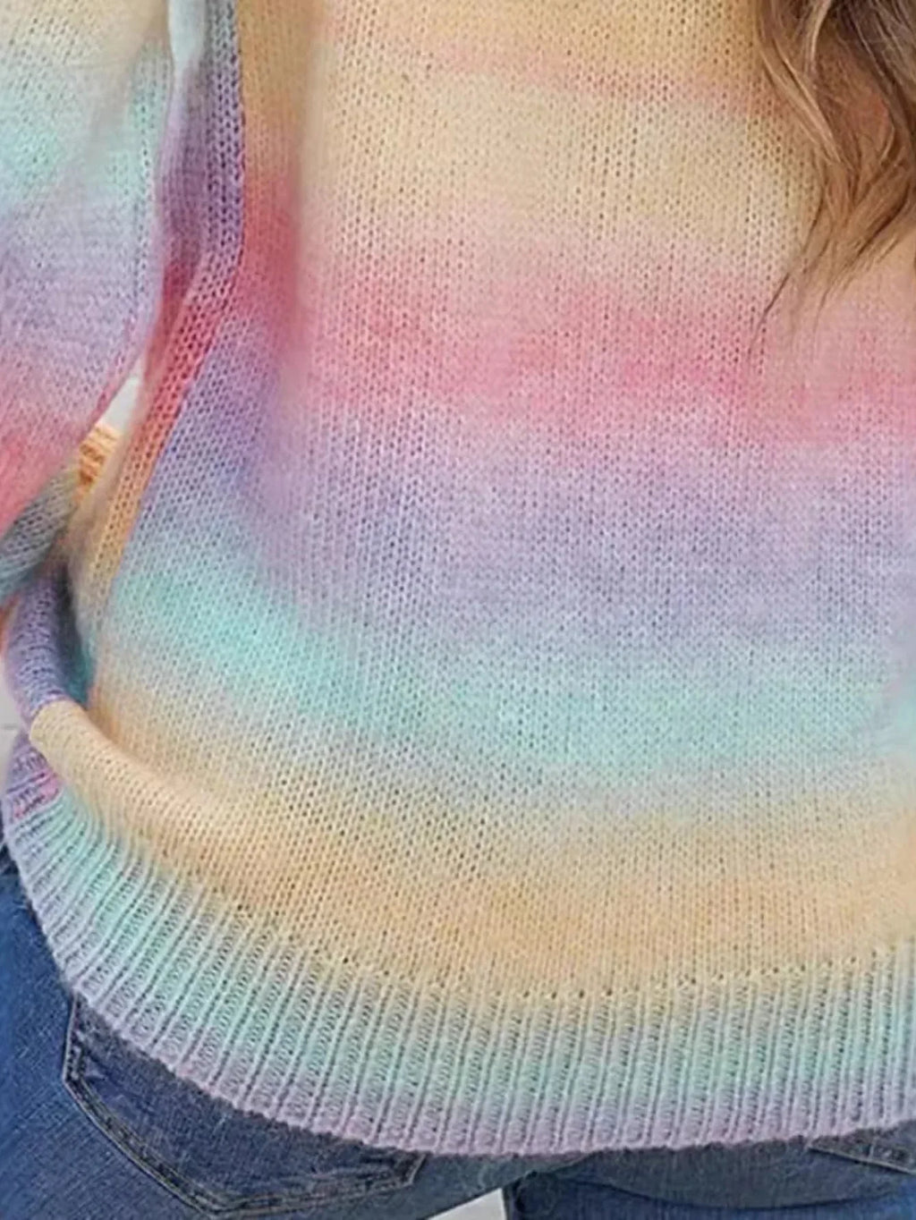 Detail of the rainbow gradient knit sweater.