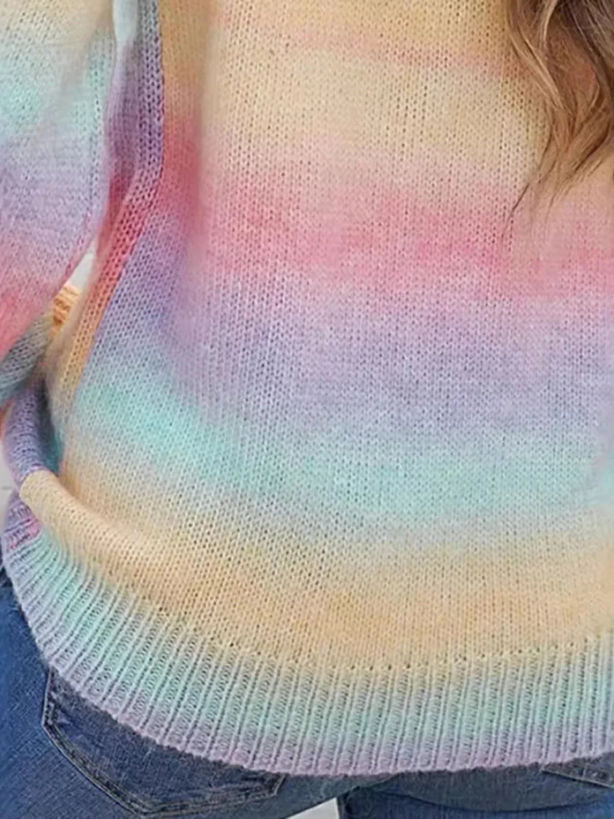 Detail of the rainbow gradient knit sweater.
