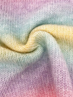 Close-up of the swirled rainbow gradient knit fabric.