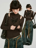 Collage of a model wearing a brown long-sleeved ribbed top with cut-out shoulders and lace-up detail, paired with distressed jeans and a decorative belt.