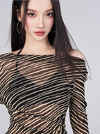 Close-up of the sheer striped fabric and off-the-shoulder neckline
