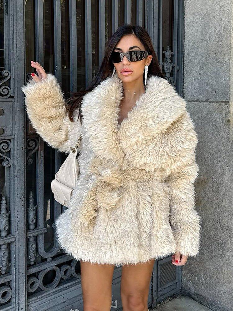 woman wearing a cream faux fur coat with a large collar and a belt Main image
