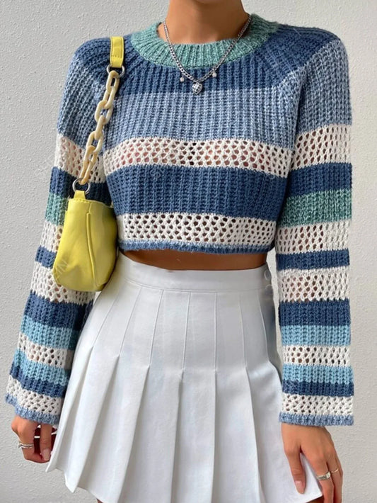 Woman wearing a blue and white striped crochet knit cropped sweater with bell sleeves, paired with a white pleated mini skirt and a yellow handbag.