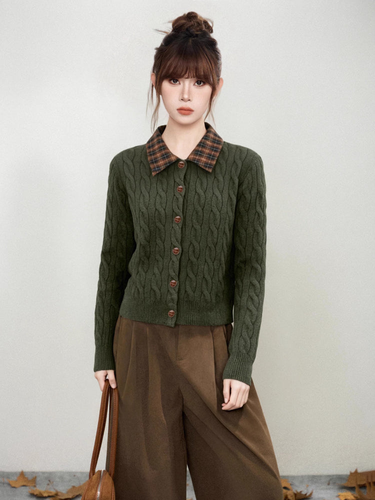 Front view of a woman in a green cable knit cardigan
