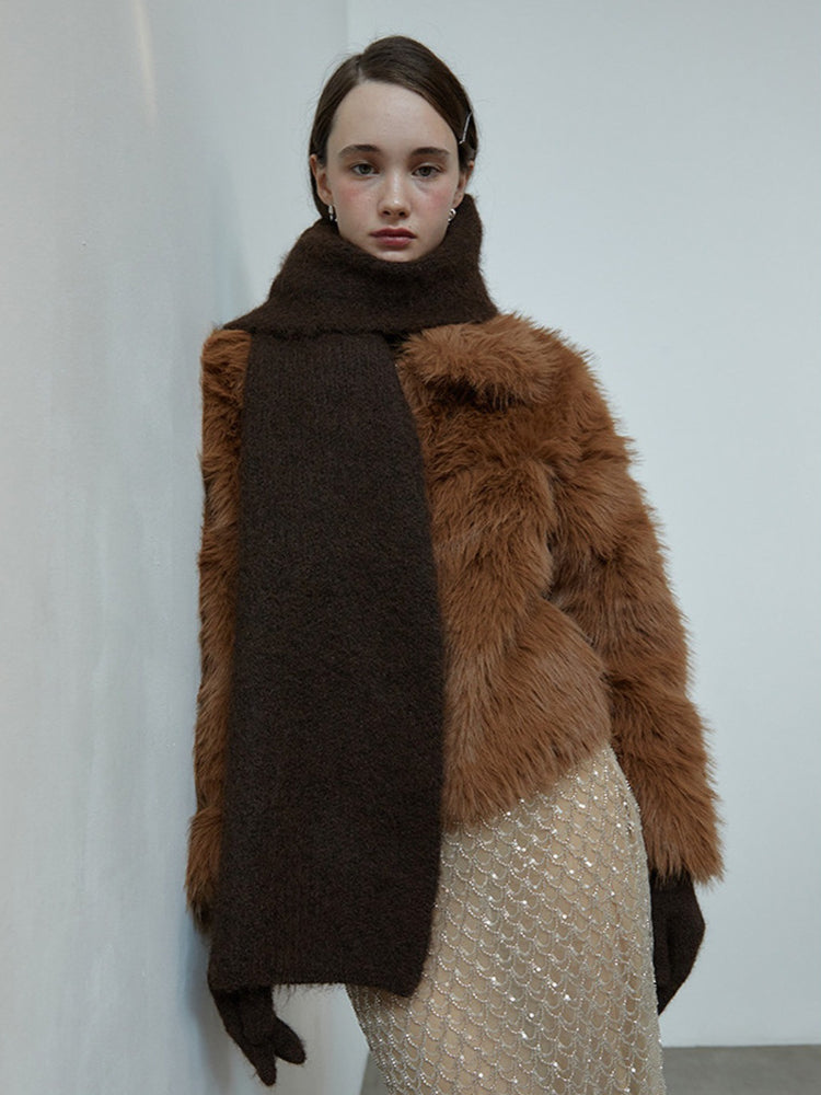 Model wearing a brown fuzzy scarf and faux fur jacket with a sequined skirt