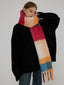 Close-up of a woman wearing a colorful plaid scarf around her neck
