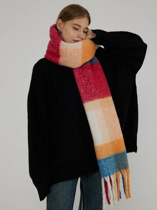 Close-up of a woman wearing a colorful plaid scarf around her neck