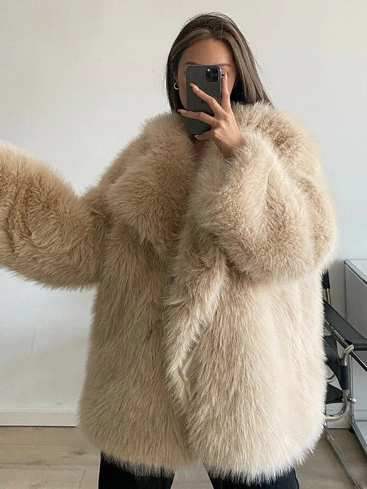 woman wearing a beige faux fur coat