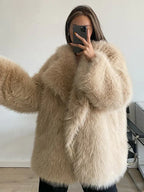 woman wearing a beige faux fur coat