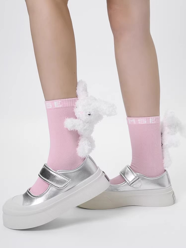 Pink ankle socks with white 3D plush bunny embellishments and silver mary jane shoes