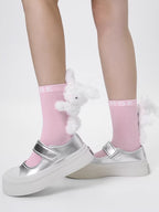Pink ankle socks with white 3D plush bunny embellishments and silver mary jane shoes