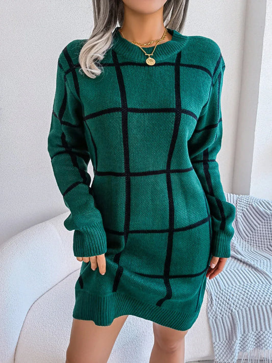 Woman wearing a green and black plaid knit sweater dress