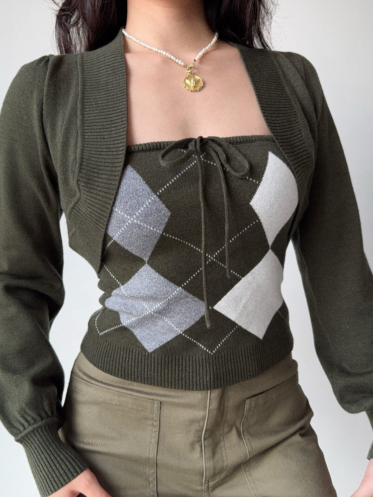 Front view of a woman wearing a two-piece knit set featuring a green argyle tube top and a matching cropped bolero cardigan.