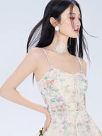 Close-up of the floral print and ruched bodice of a mini dress.