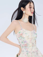 Close-up of the floral print and ruched bodice of a mini dress.