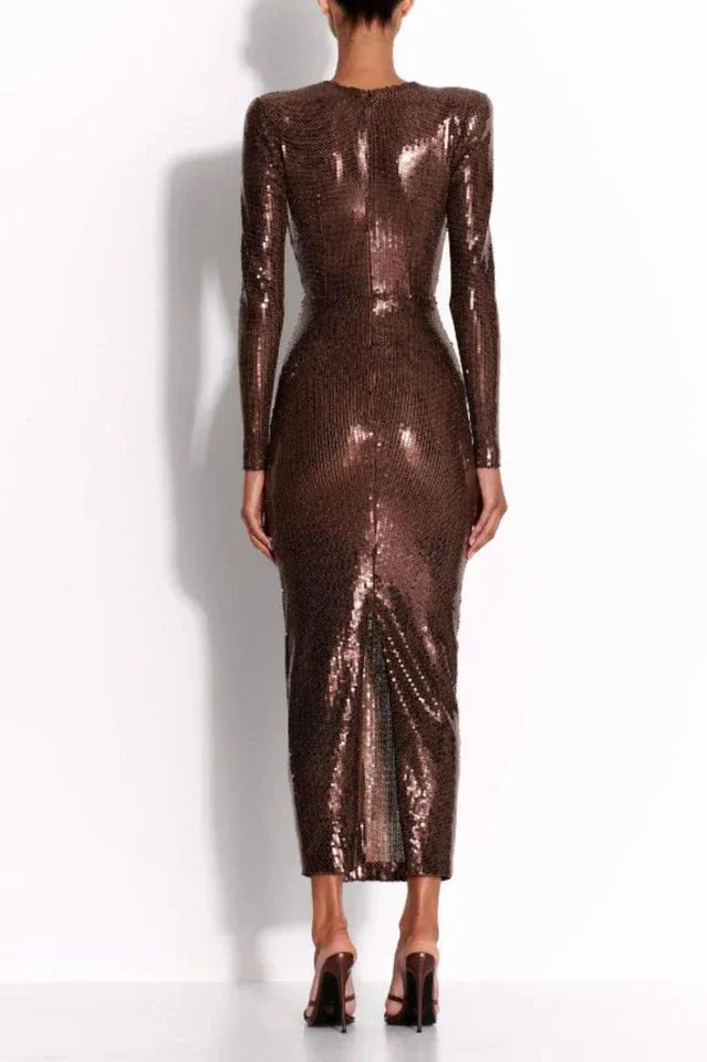 Back view of a model wearing a long-sleeved, deep V-neck, brown sequined midi dress with a ruched waist. Secondary image