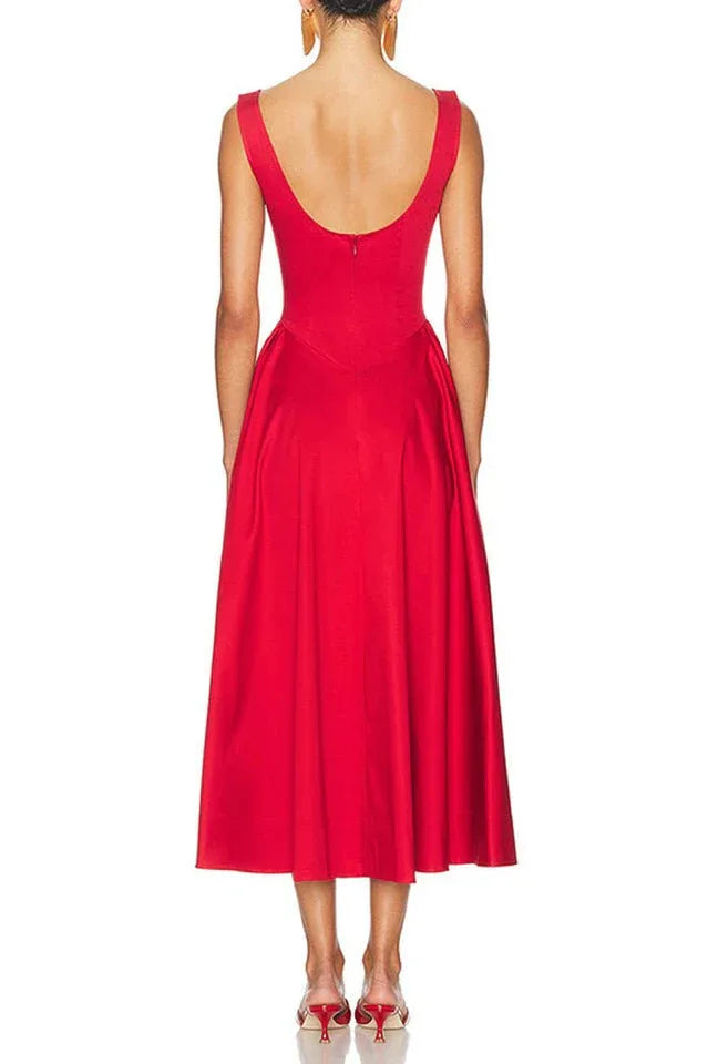 Back view of a model in a red sleeveless midi dress with a boat neck and full skirt.