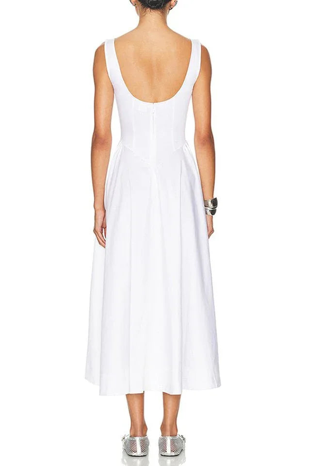 Back view of a model in a white sleeveless midi dress with a boat neck and full skirt.