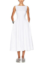 Model wearing a white sleeveless midi dress with a boat neck and full skirt.