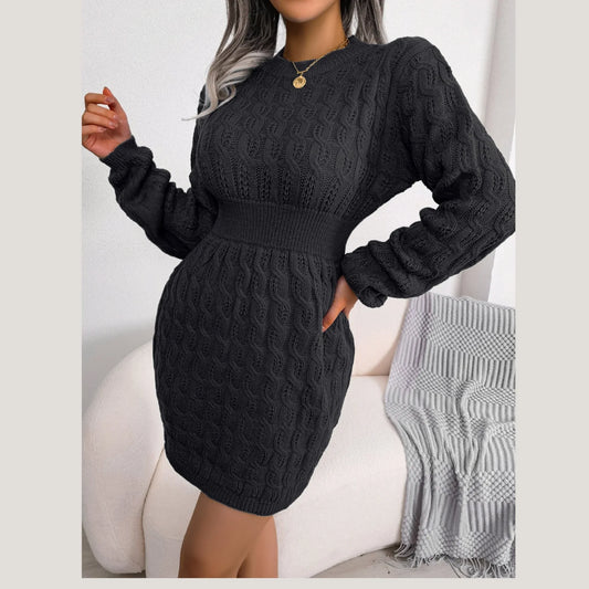 Front view of a woman in a black long-sleeved knit dress.