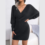 Full body shot of a woman in a charcoal ribbed knit dress.
