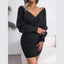 Woman wearing a charcoal ribbed knit V-neck mini dress with long sleeves and a wrap front.