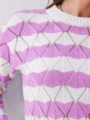 Close-up of the shoulder and neckline of a purple and white striped knit sweater with an open-knit geometric pattern.