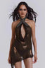 Model wearing a distressed knit halter mini dress with an open cutout and asymmetrical hem
