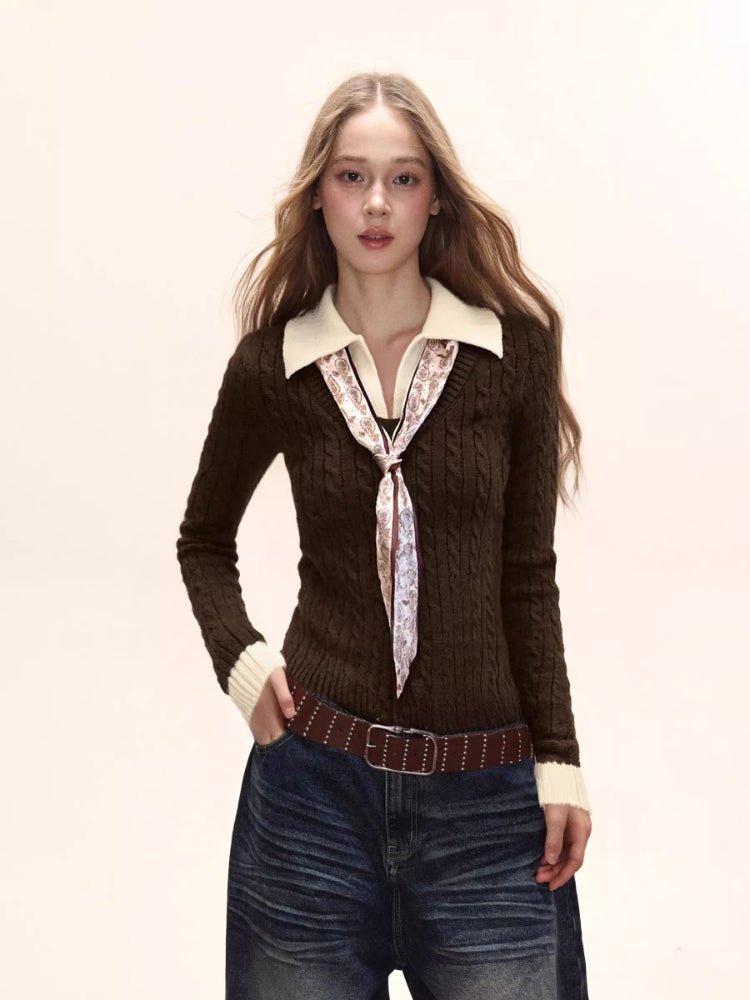 Woman wearing a dark brown fitted knit sweater with a cream collared shirt underneath and a patterned tie, paired with dark wash wide-leg jeans.