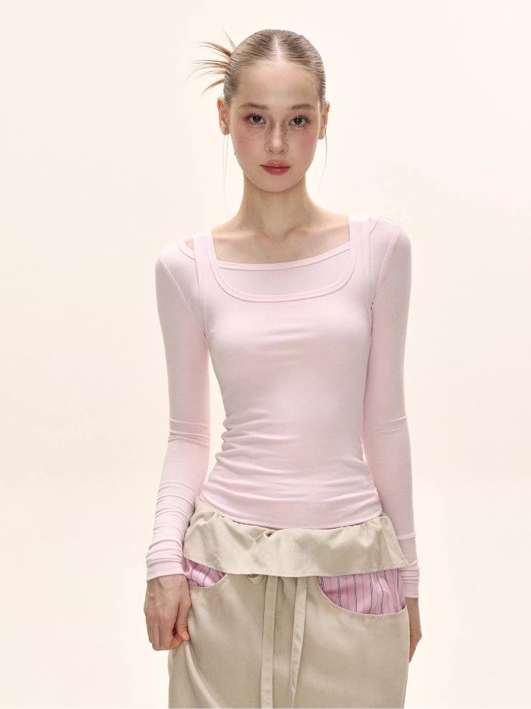 Close-up of a model wearing a pink long-sleeved square neck top and a beige maxi skirt.