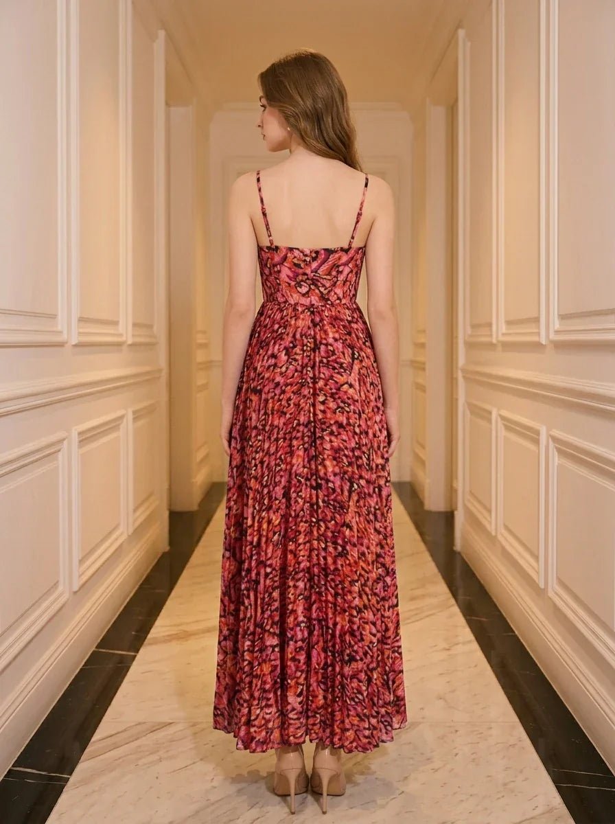 Back view of a woman in a red floral print maxi dress