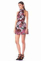 Side view of a model showcasing the A-line silhouette of a floral sequin dress