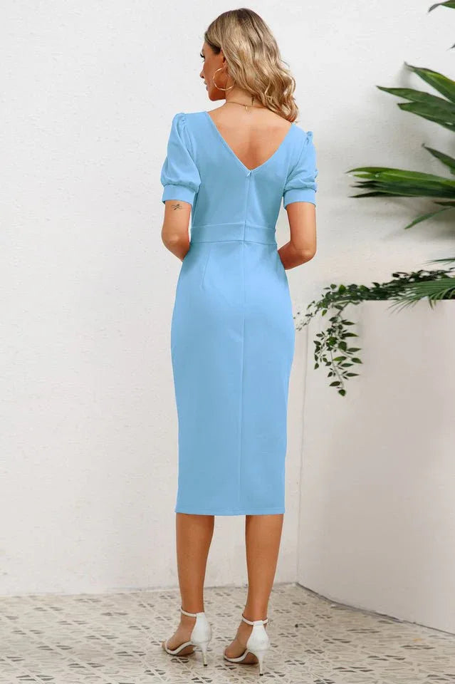 back view of woman in blue sheath dress