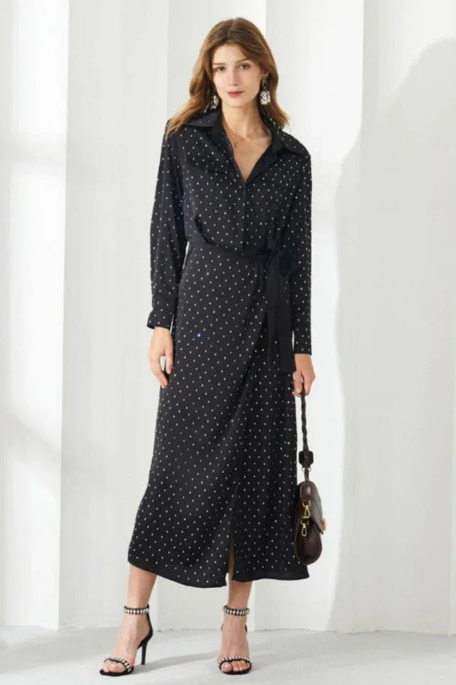 Woman in a black polka dot midi dress with a belt Secondary image
