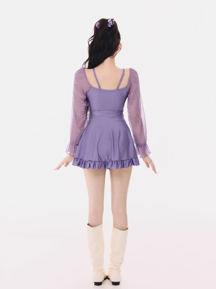 Rear view of the purple swimsuit, showing the back design.