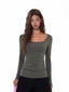 Model wearing a fitted, grey, long-sleeved, scoop neck top with a ribbed texture and ruched side detail.