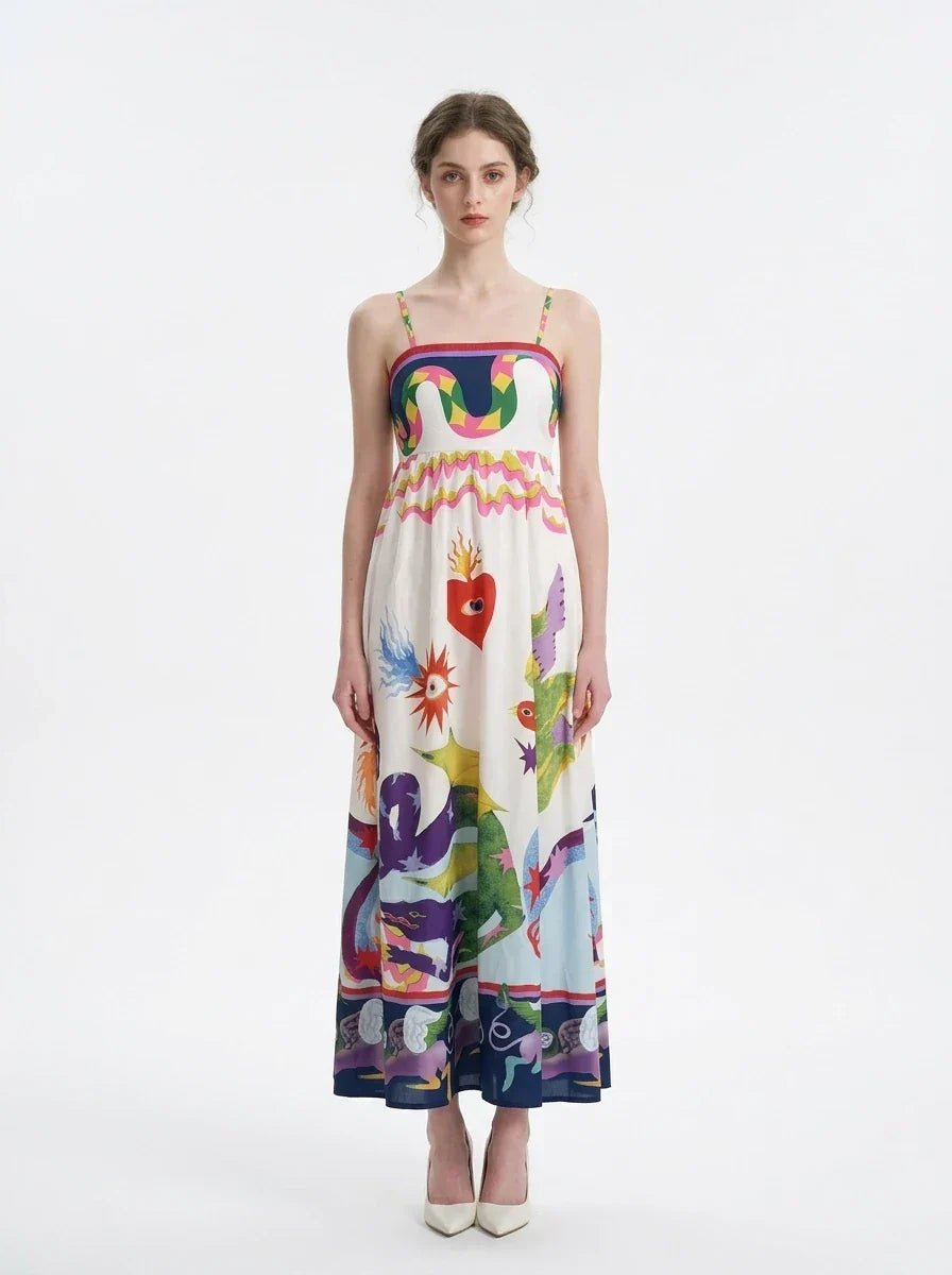 Woman wearing a white sleeveless maxi dress with a colorful graphic print and spaghetti straps, front view